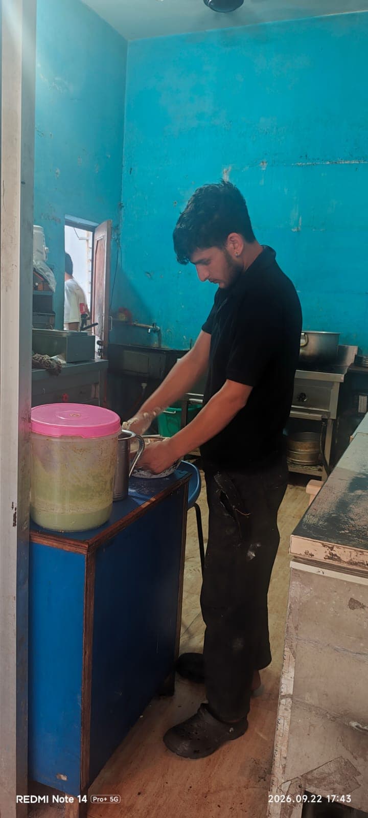 Hand-kneaded dough and tandoor bread preparation at Singh Bites